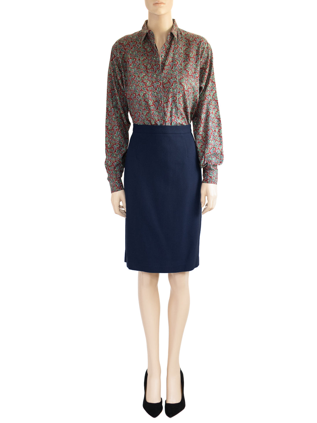 The model is wearing a Chaus's vintage dark blue wool skirt as part of a two-piece 1980s suit. 