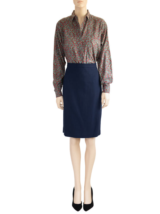 The model is wearing a Chaus's vintage dark blue wool skirt as part of a two-piece 1980s suit. 